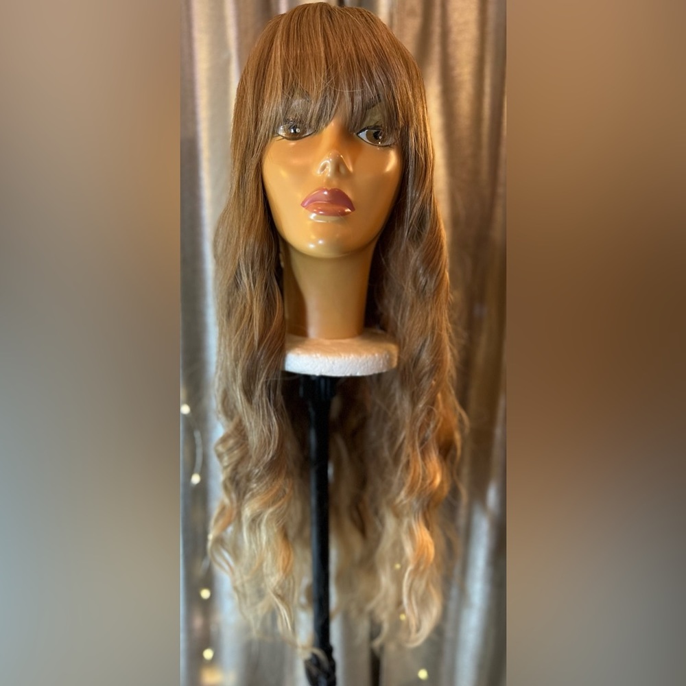Light brown synthetic 28” body curl wig unit with bangs. Brand new of course.